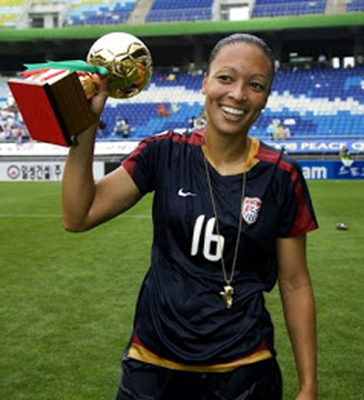 USWNT midfielder (16) Angela Hucles holds the trophy for most valuable player, the golden ball, after the finals of the Peace Queen Cup. The USWNT defeated Canada, 1-0, at Suwon World Cup Stadium in Suwon, South Korea.